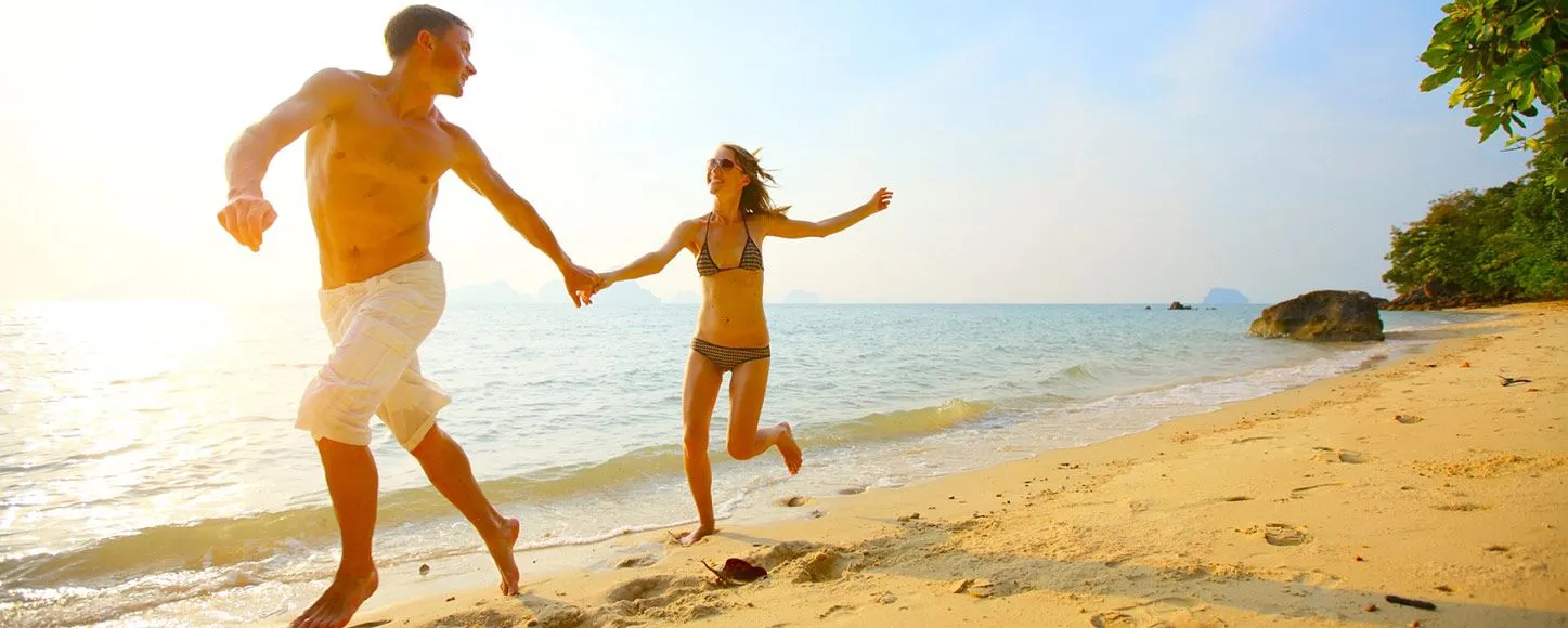 Couple running on the beach